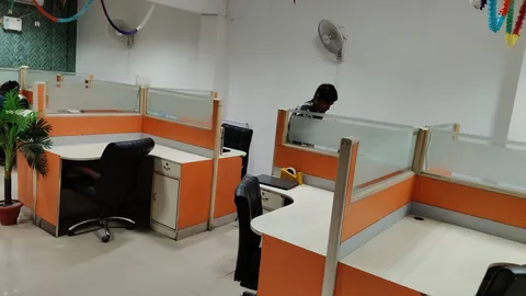 Desks arranged with workspace partitions.